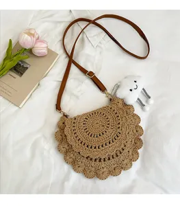 Detail of hand-woven saddle bag with layered edges and a cute cloud charm