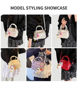 Detailed views of mini pillow bags in four colors with decorative furry pom-pom charms
