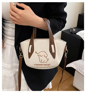 Close-up of cute dog embroidery and stitching details on the white denim tote bag