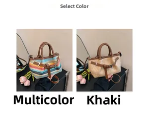 Detail of woven beach tote bags with leather handles in striped and khaki patterns
