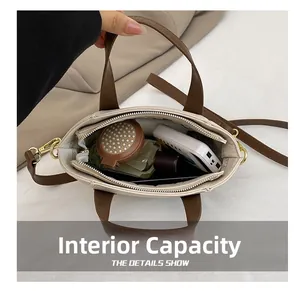 Top view of cream white denim tote showing large interior capacity and zipper pocket detail