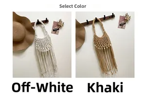 Detail of bohemian fringed woven bags in off-white and khaki with decorative wooden beads