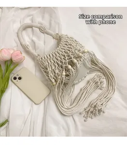 Detail of bohemian woven rope bag showing size comparison with a smartphone and flowers