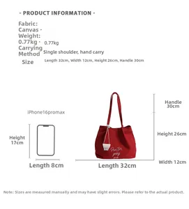 Canvas tote bag dimensions 32x12x26cm with 30cm handle and embroidered lettering details