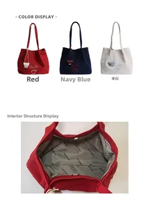 Three embroidered canvas tote bags in red, navy, and beige with magnetic closure detail