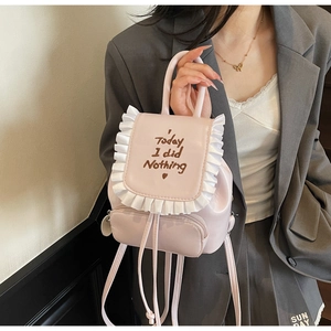 Pink mini backpack featuring white ruffled trim and Today I did nothing heart print