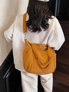 Ginger yellow large capacity canvas tote bag with adjustable strap and side pockets