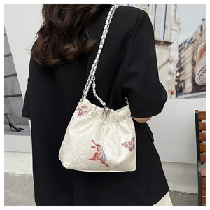 Detail of floral butterfly embroidery on high-quality jacquard canvas drawstring bag