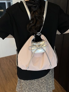 Pink pleated backpack with silver metallic flap and bow drawstring for women