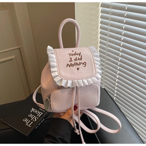 Detailed view of light pink mini backpack with pleated trim and Today I did Nothing embroidery