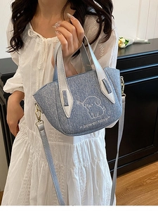 Blue denim crossbody bag featuring cute cartoon dog embroidery and dual top handles