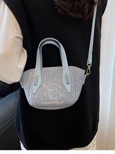 Glittery light blue mini tote bag with puppy pattern and golden hardware details