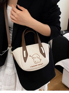 Chic off-white embroidered denim tote bag with cartoon dog pattern and leather strap