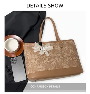 Macro detail of floral embroidered tote bag with leather trim and silk butterfly charm