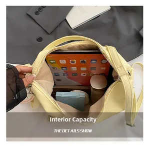 Detail showing high capacity interior of yellow crocodile texture tote bag with tablet