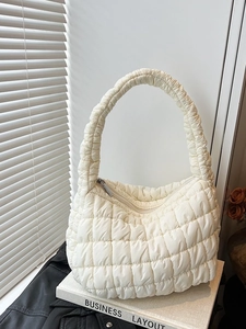 Elegant creamy white quilted cloud bag with pleated design and comfortable shoulder strap