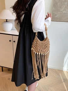 Bohemian handmade woven tote bag with tassel fringe and beads in natural khaki