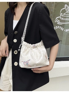 Floral embroidered white satin shoulder bag with vintage silver chain strap for women