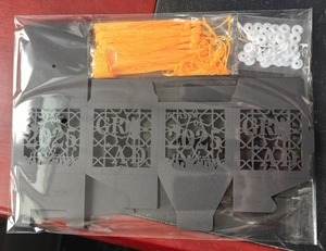 Detail of DIY 2025 graduation gift box kit with black hollow cutout and orange tassel