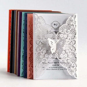 Elegant laser-cut butterfly wedding invitation set with pearl paper lace details