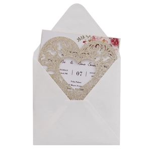 Glitter gold laser cut heart wedding invitation with floral insert and white envelope
