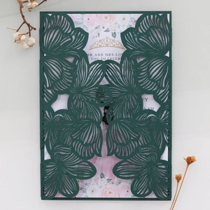 Elegant laser cut dark green wedding invitation with floral patterns and pink rose card