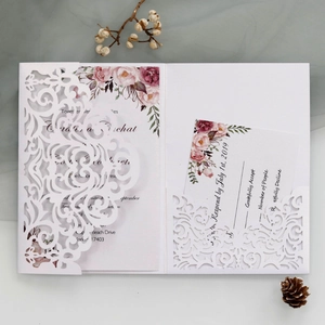 Laser cut wedding invitation set with floral design and elegant hollow cover