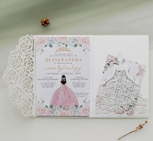 Detail of laser-cut rose hollow invitation with pink Quinceañera princess insert card