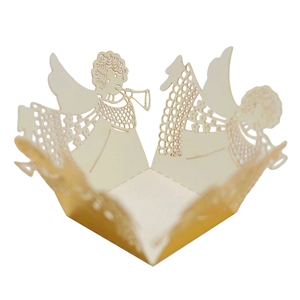 Macro detail of laser-cut cream cupcake wrapper with an elegant angel cutout design