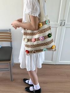 Handmade crochet striped tote bag with colorful 3D flowers for beach and casual use
