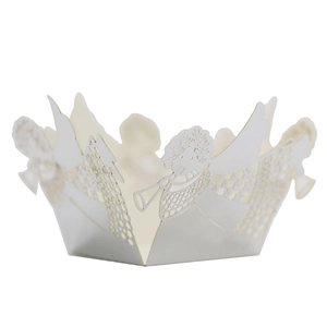 Detail of laser-cut white pearl paper cupcake wrapper with angel trumpet motif