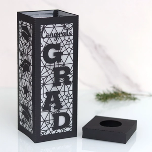 Hollow black laser-cut graduation paper lantern with Congrats GRAD text and base