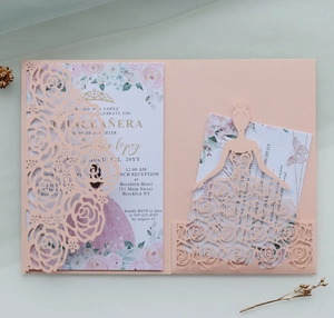 Detail view of pink laser-cut Quinceañera invitation set with rose patterns and RSVP cards