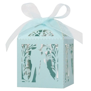 Detailed laser cut wedding favor box in light blue with white ribbon and bride silhouette