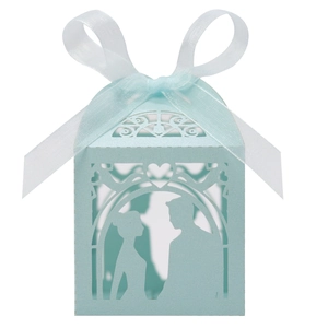 Detailed laser-cut light blue wedding candy box featuring a bride and groom silhouette