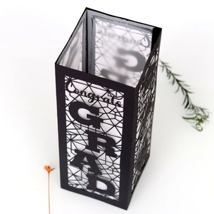Black laser-cut Congrats GRAD paper lantern for graduation party decor and celebrations