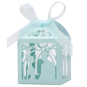 Detailed laser-cut light blue wedding candy box with ribbon and bride groom silhouette
