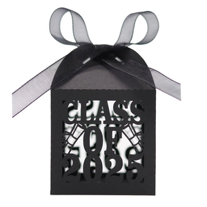 Detail of laser-cut Class of 2025 graduation candy box with black ribbon and cap design