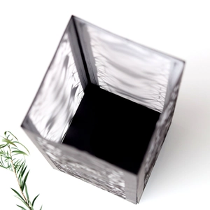 Macro view of black hollowed paper lantern with intricate laser-cut geometric patterns