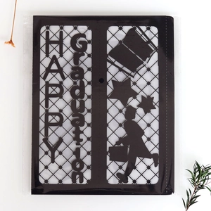 Detail of laser-cut black Graduation paper lantern with silhouette and HAPPY text