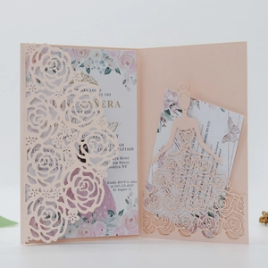 Detail of pink laser-cut rose invitation with Quinceañera floral silhouette insert