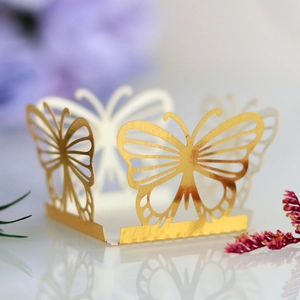 Golden butterfly laser cut cupcake wrappers with hollow patterns for wedding favors