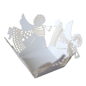 Detailed laser-cut white cupcake wrapper featuring a delicate angel pattern for weddings