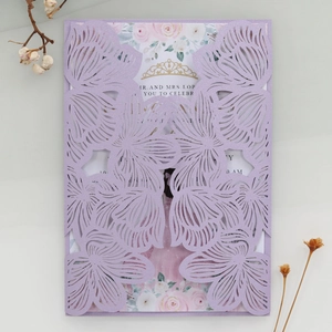 Detailed laser-cut lavender wedding invitation with hollow floral patterns and inner card
