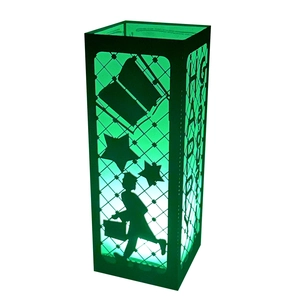 Detail view of black laser-cut graduation lantern with green LED light and silhouette