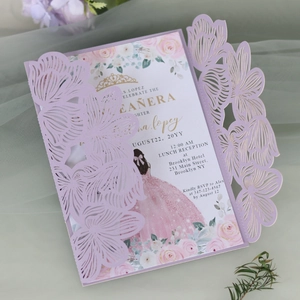 Intricate laser-cut purple floral wedding invitation set with elegant pink rose insert
