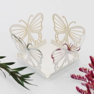Detailed laser-cut butterfly cupcake wrapper made of premium white cardstock for weddings