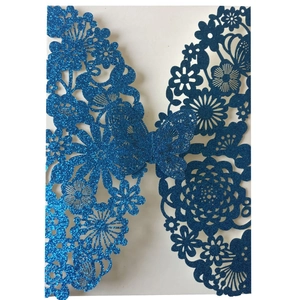 Laser-cut royal blue glitter butterfly invitation card with intricate floral patterns