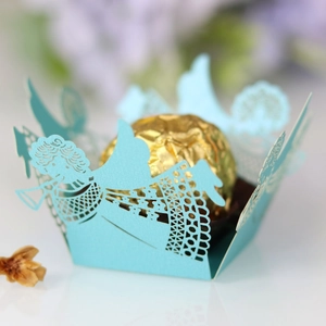 Light blue laser-cut angel candy box for weddings featuring hollow design and gold chocolate
