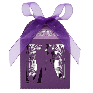 Detailed laser-cut silhouette and floral pattern on purple cardstock wedding favor box